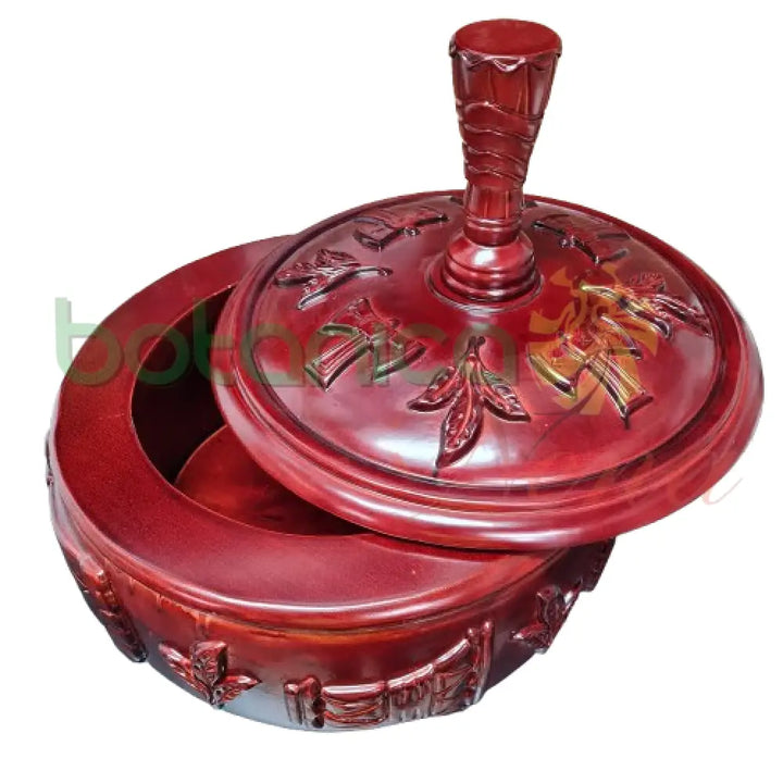 Close-up of carved wood lid – Afro-Caribbean altar centerpiece