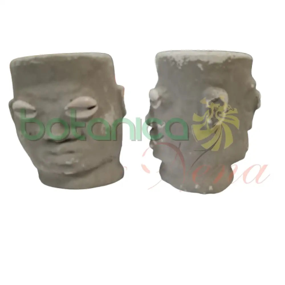 Elegua Dos Caras Cemento 4’’Alto 2 caras color oscuro