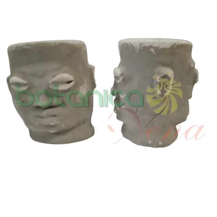 Elegua Dos Caras Cemento 4’’Alto 2 caras color oscuro