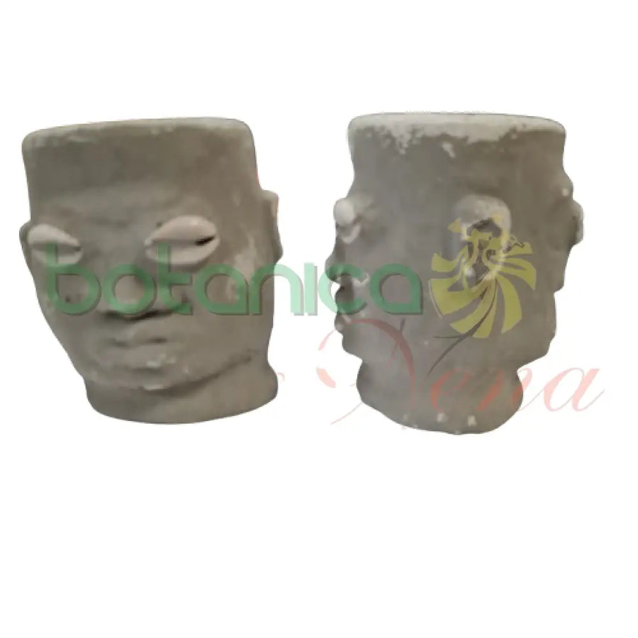 Elegua Dos Caras Cemento 4’’Alto 2 caras color oscuro