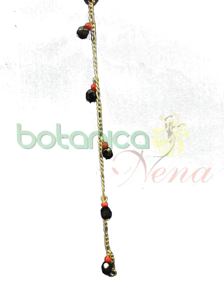 Pulsera mano de azabache y coral dorada - Botanica Nena